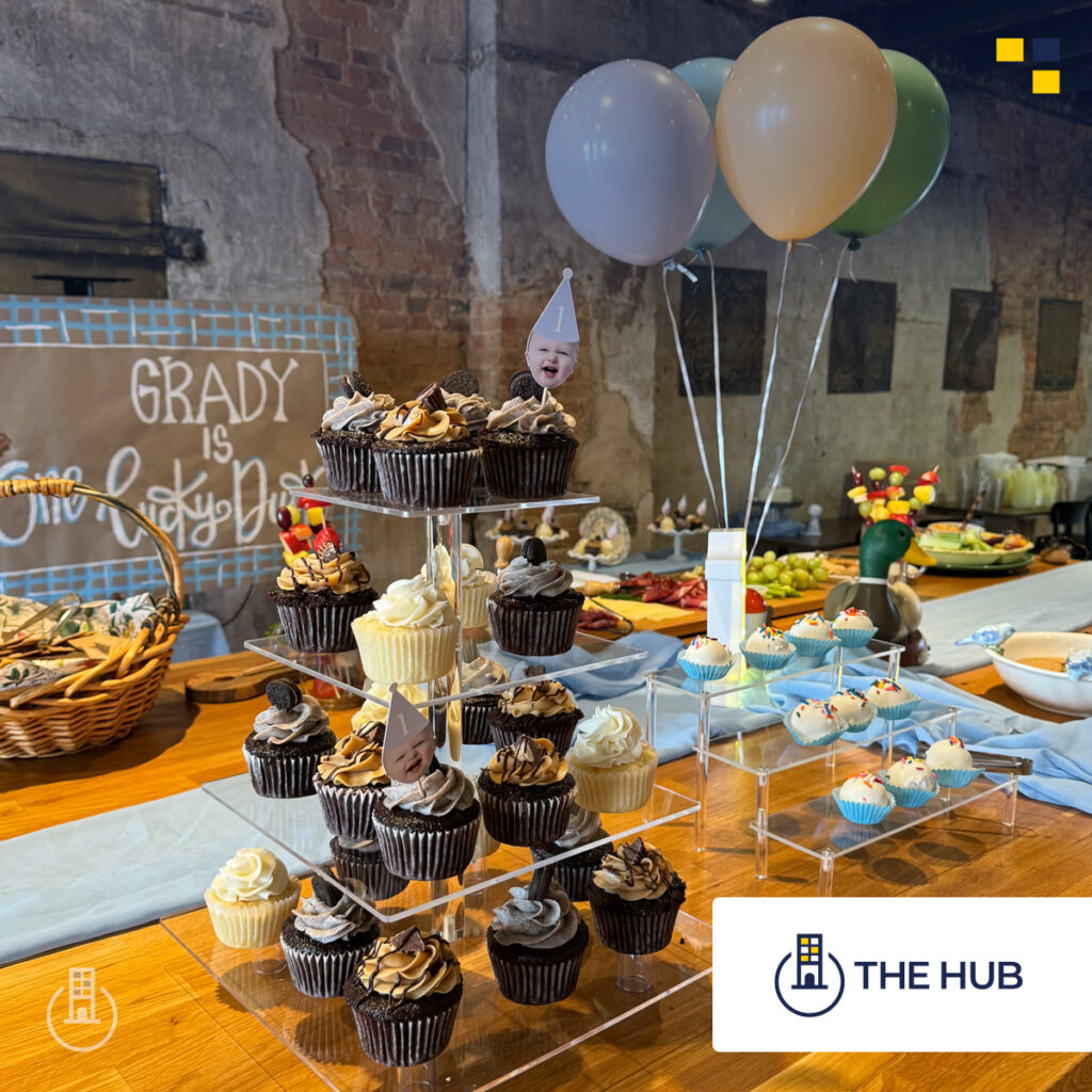 Meeting space at The Hub setup with cupcakes on a table.