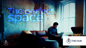The perfect space. Entrepreneur sits at a large event room.