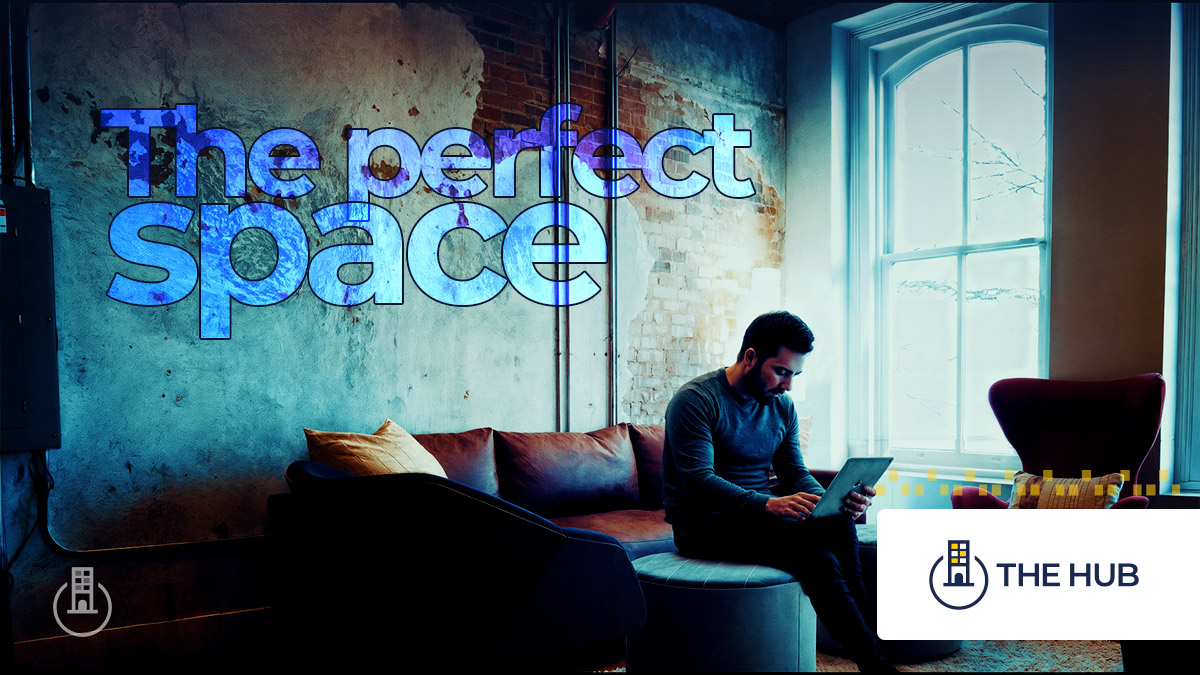 The perfect space. Entrepreneur sits at a large event room.