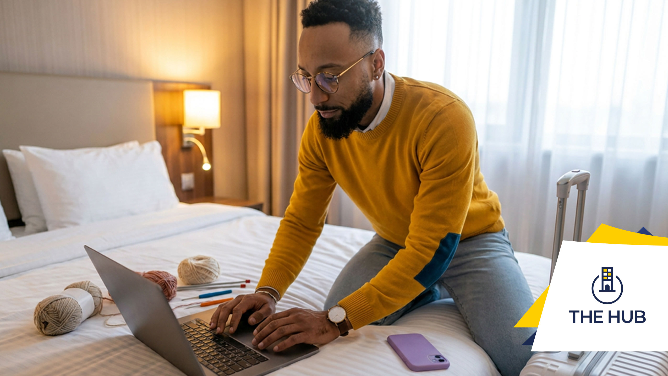 Digital Nomad working in the hotel bed.
